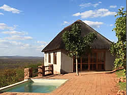 The Garamtata Lodge offers four comfortable en-suite chalets, situated on top of a ridge overlooking a waterhole